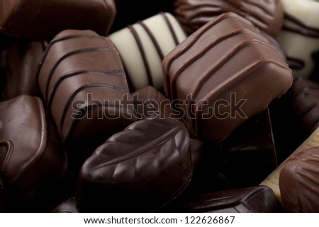 Horizontal image of assorted chocolates in different shapes and size