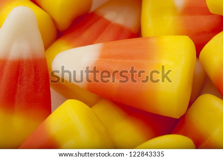 Candy corn is derives it shape and color from a corn kernel, corn syrup is one of its main ingredients.