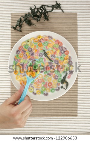Overhead shot of eating breakfast cereals with armed toy soldiers
