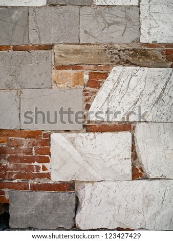 Ancient walls where blocks and bricks European craftsmanship have repaired the erosion.