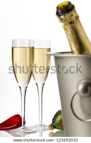 Close-up shot of a bucket with two wine glass in background.