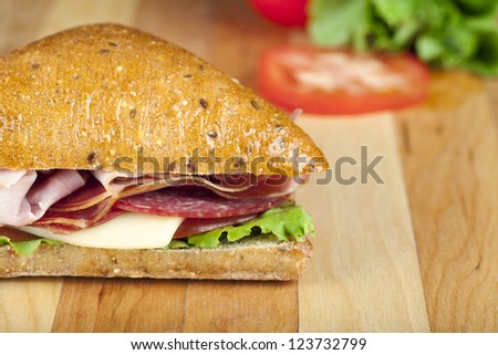 Close up image of ham sandwich with sweet bread against white background