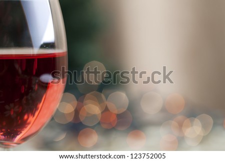 Red wine and Christmas light reflection with soft focus