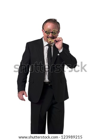 Happy mature businessman biting his dollar necklace while standing over white background