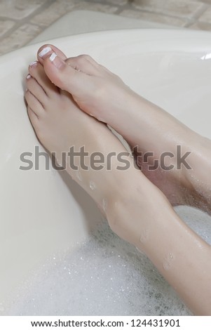 Close up image of woman foot in the bath tub