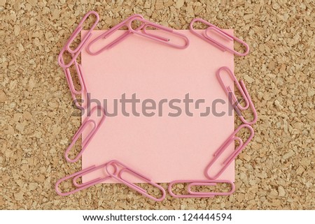 Image of pink adhesive paper and paper clips
