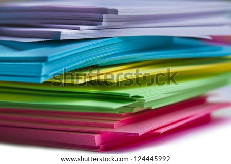 Colorful sticky notes are randomly stacked together