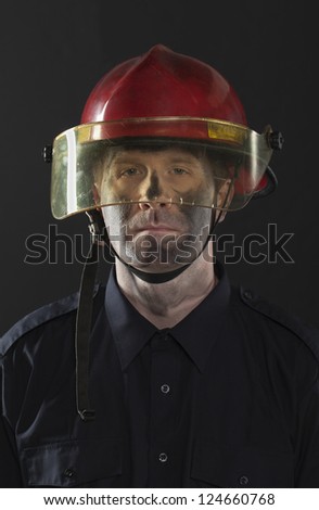 Closeup shot of a firefighter with dirty face
