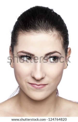 Close-up of beautiful woman\'s face looking away on a white surface