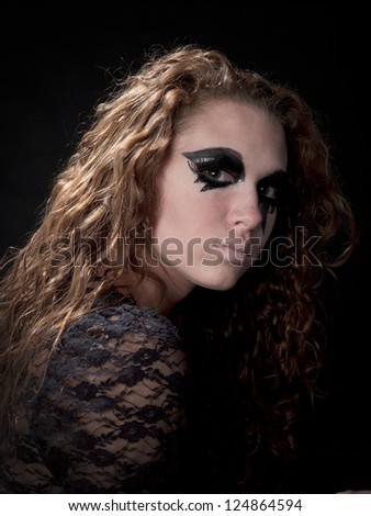 Side shot of a girl in Gothic make up