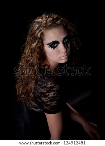 Gothic girl looks over shoulder