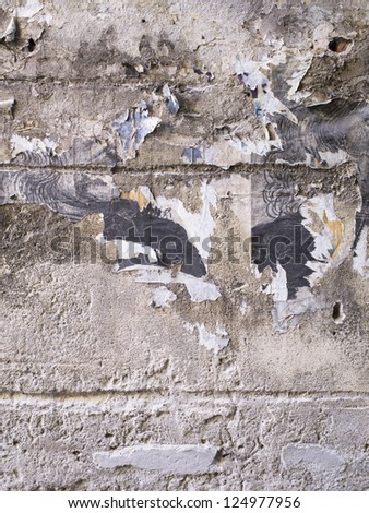A portrait of a dirty abandoned stone wall of a house