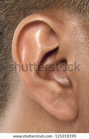 Close up image of human male ear
