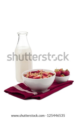 Cereal Rings with strawberry fruits and milk bottle isolated on white background