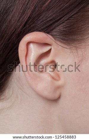 Close-up image of a woman\'s right ear
