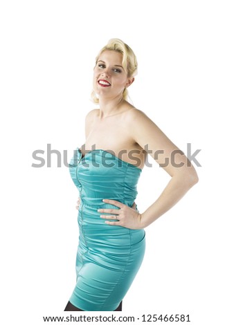 Sexy blond woman in aqua blue dress with hands on hips