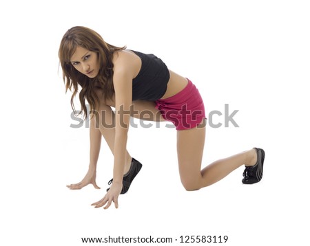 Close-up image of a sporty lady on a running pose against the white background