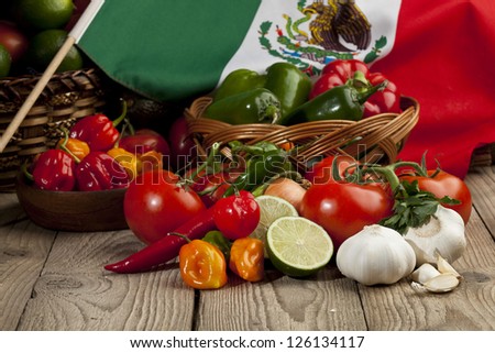 Set of mexican vegetables arranged in table with a mexican flag