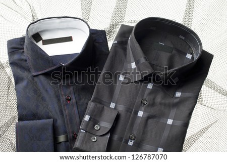 Image of men's shirts on printed background