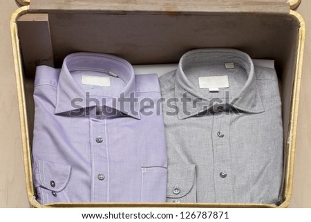 Two polo shirts folded neatly