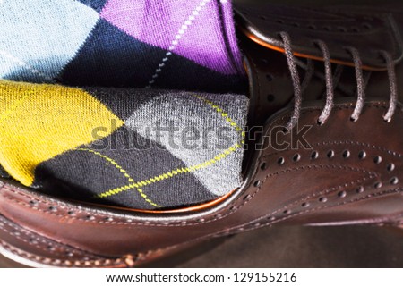 Argyle sock at the top of leather shoe