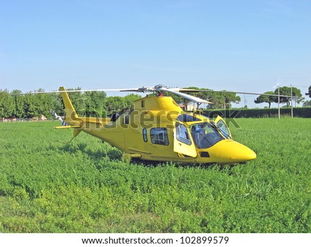 yellow helicopter rescue air ambulance take off