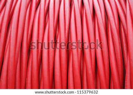 storage of Red cord coiled around a cylindrical Coil