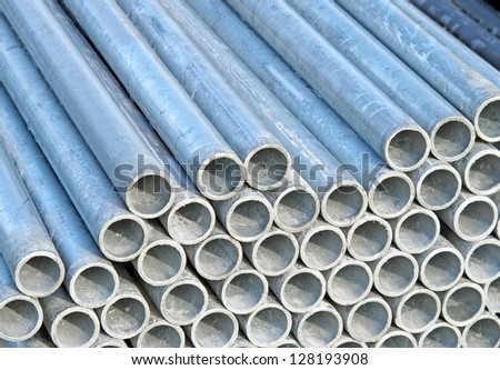 pile of iron pipes for the transport of electrical cables and optical fibres and municipal tap water