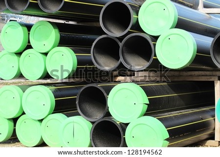 piles of plastic pipes and conduits for transporting water and gas