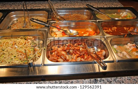 steel tray filled with food inside the self service Chinese restaurant