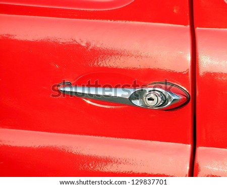 glitter  handle of a red car