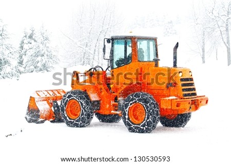 snow plows to work clearing the snow