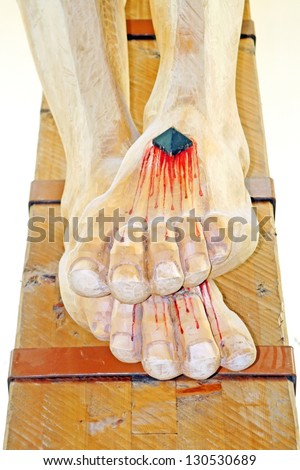 nailed and bleeding feet of Jesus in the chruch