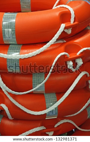 piles of Orange life preserver for help to people in danger of drowning