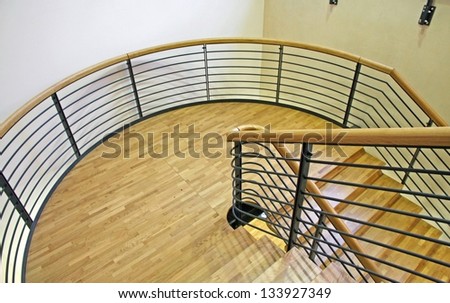 wood spiral staircase with very wide curve