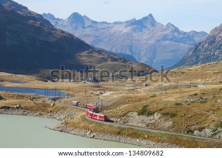 famous red train around the beautiful Swiss mountains 36