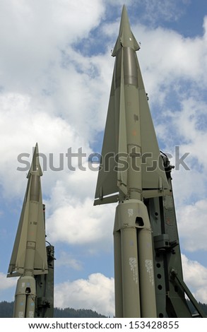 two missiles with a nuclear warhead ready to launch from a military base