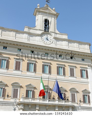 Palazzo Montecitorio headquarters of the Italian Parliament with the Italian flag