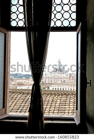 look stolen of the majestic dome of St. Peter\'s basilica seen from a window with the curtains drawn