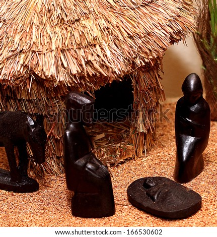 Nativity set in an African village with wooden figurines 2