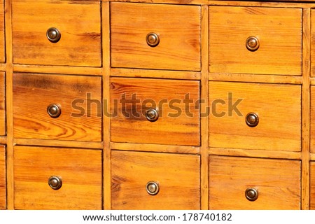 antique chest of drawers in solid wood with brass knobs on sale in antiques shop