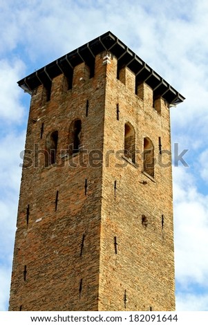 ancient medieval tower built with bricks for the defense of the town by the barbarian invasions