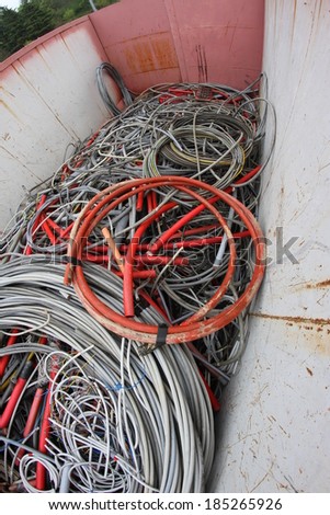 giant containers full of electric cables for recyclable waste