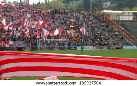 Red and white scarf of the fans in the Stadium during a football game 2