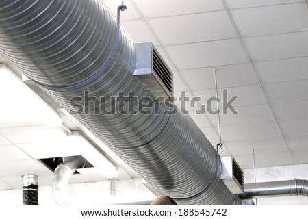long metal tube for the air-conditioning of a large workshop