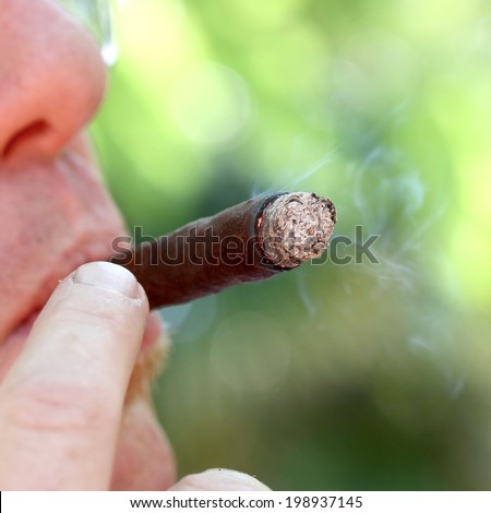 smoker while smoking the Cuban cigar and smoke 6