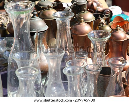 antique glass bottles and containers in copper in antique shop