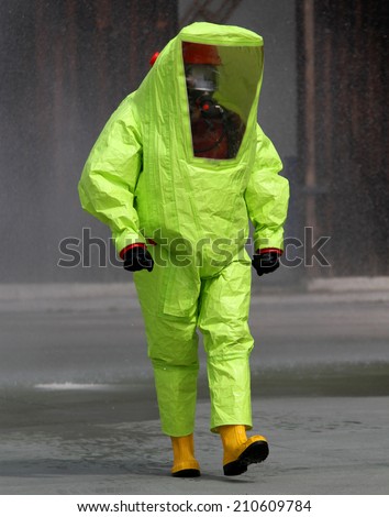 fearless rescuer with the yellow suit against biological hazard from contamination 2