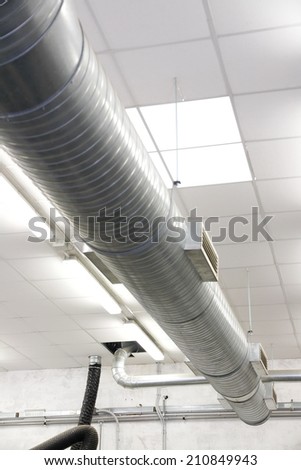 big tubes of air conditioning inside the factory 1