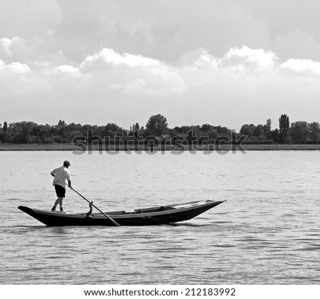 man on the boat in the lagoon of Venice
